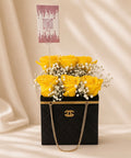 Handbag-style arrangement with fresh yellow flowers by JoDetails