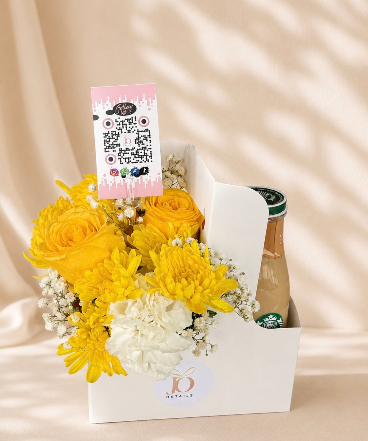 Yellow flower arrangement with Starbucks drink by JoDetails
